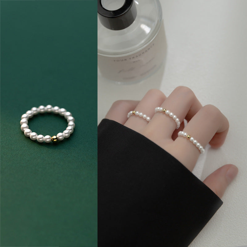 Delicate Gold-Tone Ring with Light Bead Accent – Minimalist Fashion Jewelry
