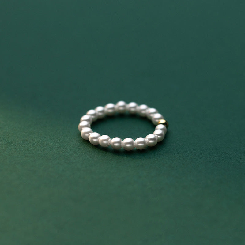 Delicate Gold-Tone Ring with Light Bead Accent – Minimalist Fashion Jewelry