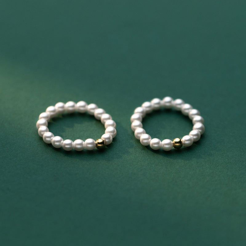 Delicate Gold-Tone Ring with Light Bead Accent – Minimalist Fashion Jewelry