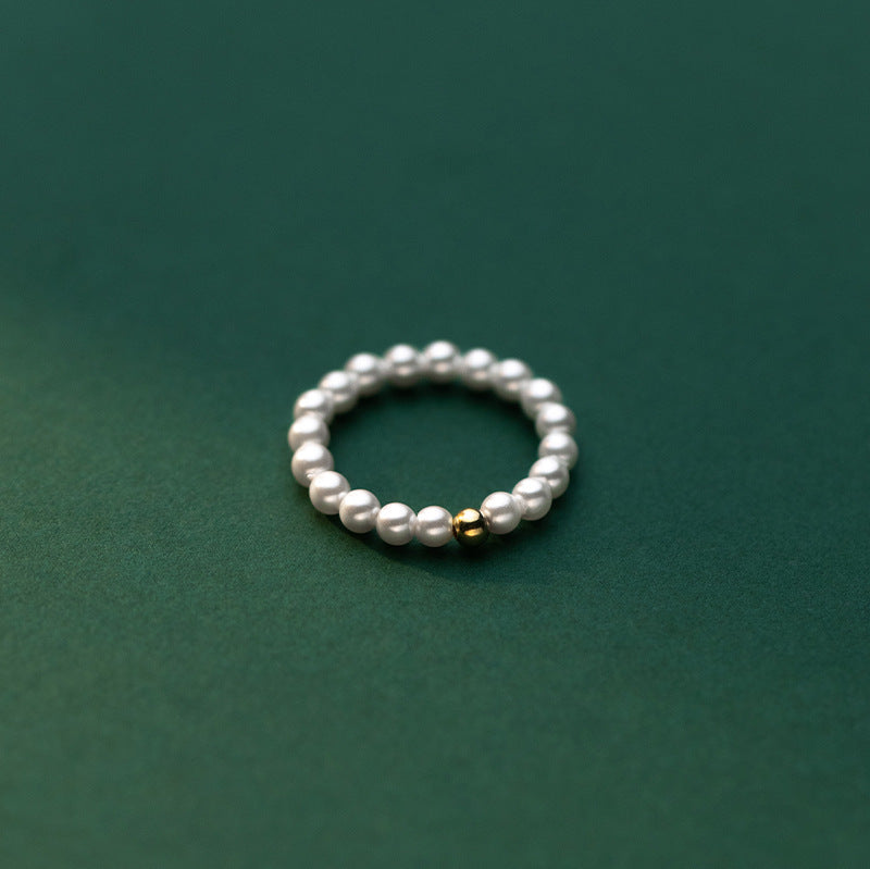 Delicate Gold-Tone Ring with Light Bead Accent – Minimalist Fashion Jewelry